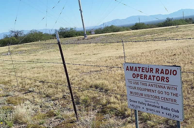 Sign on a fence stating Amateur radio operators area. 