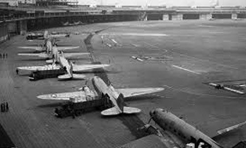 Planes lined up at an airport in 1948-1949.